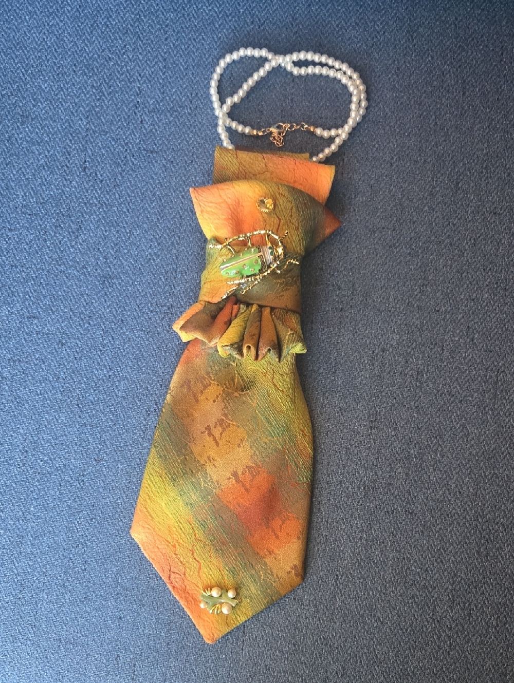 3/$60 Vintage Orange Green Cravat with Green Beetle Brooch Detail